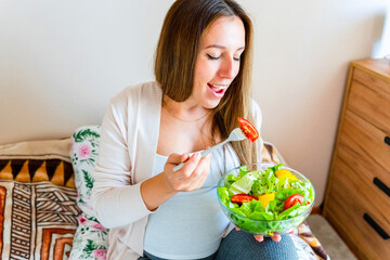 Pregnant healthy food diet. Pregnancy woman eating nutrition diet food salad. Healthy vegetarian food, healthy lifestyle.