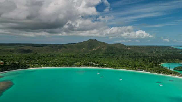 Aerial hyperlapse flying towards famous tourist spot Kuto Beach on Isle of Pines.