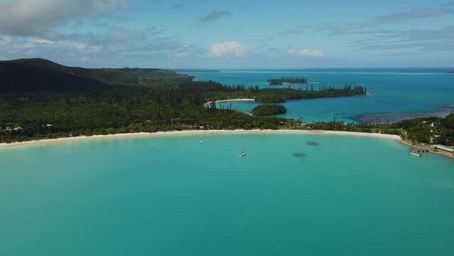Aerial pullout establishing shot of Kuto and Kanumera Beaches, Bays, Isle of Pines.