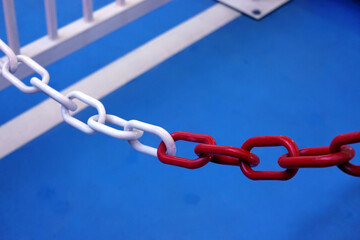 Plastic chain in white and red. focus on foreground and blurred background      