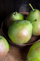 washed ripe green pears on the cutting board