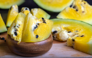 Ripe and juicy yellow watermelon cut into pieces