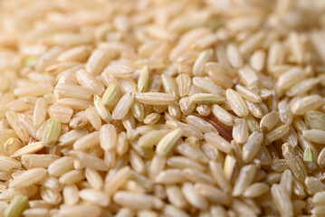 Organic Thai brown rice grain texture background, Asian healthy food ingredients