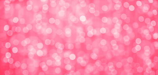 Defocused abstract red lights background. Tones of color of year 2023 - Viva Magenta background
