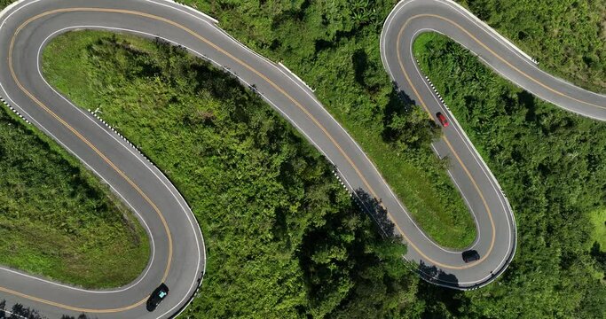aerial view ROAD No.1081 beautiful curve winding mountain road between Pua District,Nan Province, Northern of Thailand 4k video from drone camera,