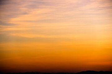 ฺBeautiful orange gold sky before sunrise over mountains view background