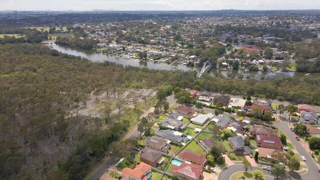 Aerial drone view of Voyager Point in South West Sydney, NSW Australia heading toward the footbridge on Georges River 