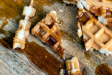 square sweet soft waffles in bee honey