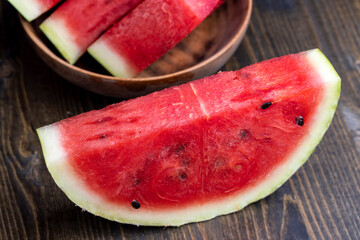 Sliced red and ripe watermelon on the table