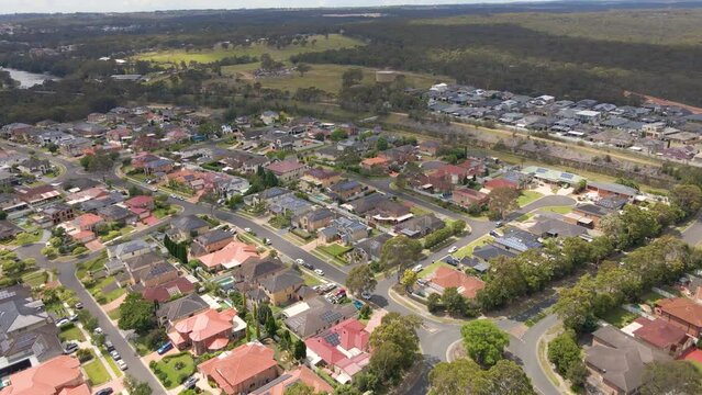 Aerial drone view of Voyager Point in South West Sydney, NSW Australia heading toward the train line and Heathcote Road  