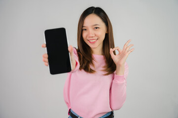 Asian girl holding laptop on white background