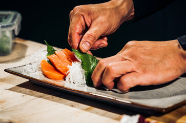 Sashimi Japanese food, Sashimi set. Salmon, wasabi, fish, shrimp,octopus, sashimi, hirame, salmon sashimi and tuna sashimi, Japanese food concept, with copy space. Dark Tone