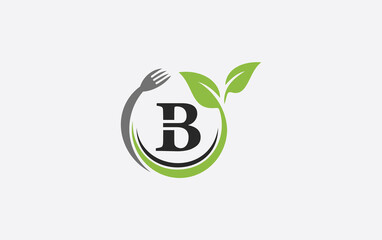 Green leaf food logo with spoon and healthy logo design image spoon fork and leaf