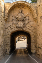Fototapeta na wymiar Internal side of the Greeks' Gate with a relief portraying St. Paul - Mdina, Malta