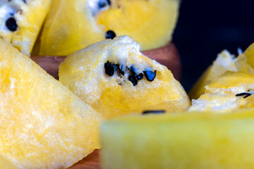 Ripe and juicy yellow watermelon cut into pieces