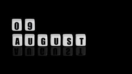 August 9th. Day 9 of month, Calendar date. White cubes with text on black background with reflection. Summer month, day of year concept
