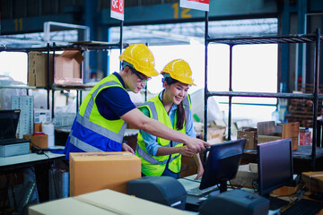 Woman worker holding barcode scanner with scanning on package box in building construction material store manufacturing warehouse, packaging products, shipping export logistics warehouse