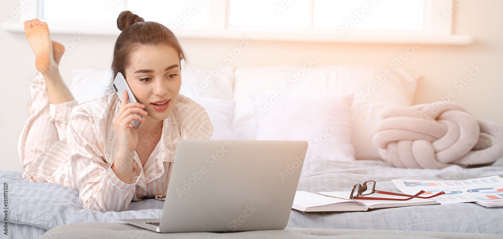 Sticker beautiful young woman in pajamas and with laptop working at home