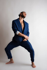 
photo session in studio of young man in blue casual suit