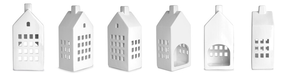 Set of creative candle holder in shape of house on white background