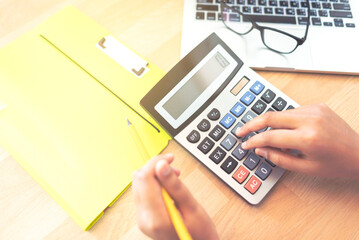 Accountant working on his calculator