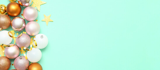 Beautiful composition with Christmas balls on turquoise background with space for text
