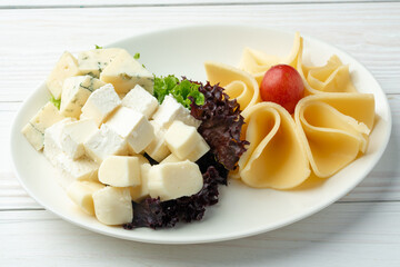 Assortment of cheese on a white plate