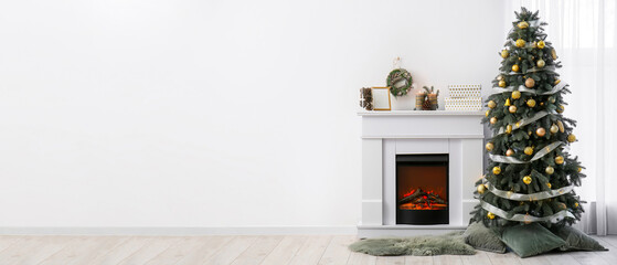 Interior of light living room with fireplace and Christmas tree
