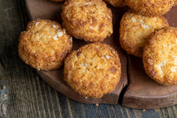Delicious cookies with coconut on the table