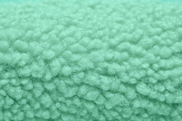 Texture of mint fluffy fabric as background