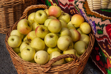 yellow apples in a wicker basket  in Bistrita, Romania