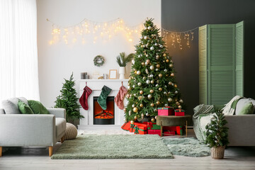 Interior of living room with electric fireplace and Christmas trees