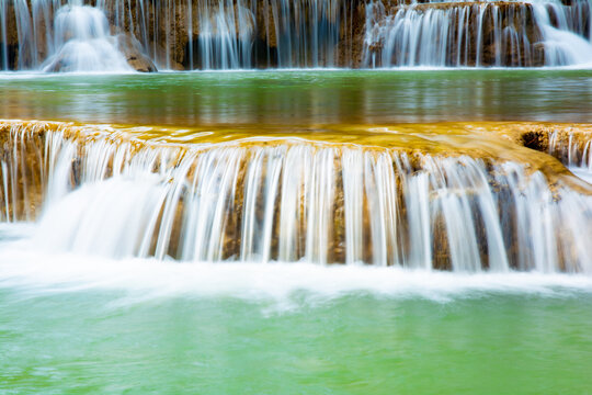 Amazing colorful waterfall in national park forest during spring,beautiful deep forest in Thailand,technic long exposure, during vacation and relax time. © auttawit