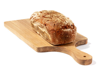 Freshly baked dark bread on a blackboard isolated on white background