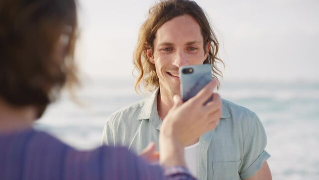 Phone, photography and portrait of man at beach for social media, blog and influencer location update in summer holiday. Ocean waves, friends or people with smartphone for profile picture post at sea