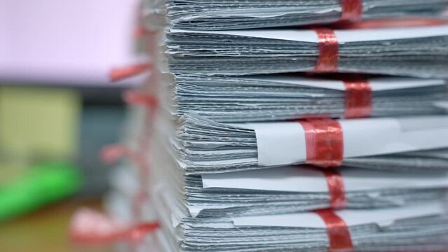 Stacks of paper files work desk office, business report papers,piles of unfinished documents achieves, Business concept.