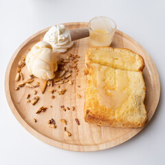 Bread rusk with ice cream and  milk syrup  on white background