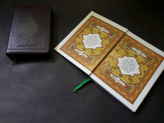 Photo of the Al Quran with a black background