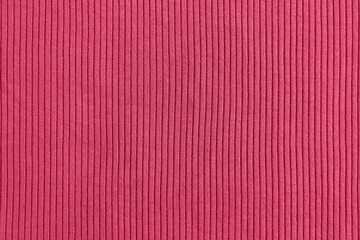 Viva magenta color of the year 2023, ribbed texture of cloth. Fabric textile pattern.