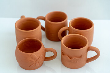 Ceramics, a ceramic product made with their own hands on a potter's wheel, a mug.