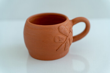 Ceramics, a ceramic product made with their own hands on a potter's wheel, a mug.