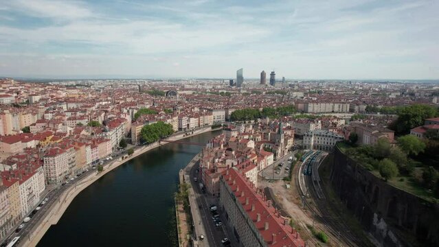 The drone aerial footage of River Saone runs through Lyon city, France. The Sa&ocirc;ne is a river in eastern France. It is a right tributary of the Rh&ocirc;ne, rising at Viom&eacute;nil in the Vosges department and jo