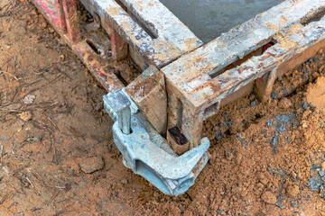 Reinforced concrete foundation of a modern monolithic residential building. Prepared formwork with reinforcing mesh for pouring concrete. Monolithic construction technologies.