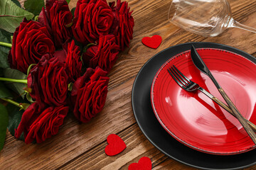 Table setting for Valentine's Day with hearts and roses on wooden background, closeup