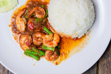 Fried Shrimp with long beans on the white dish.