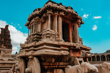 Closeup of Medieval stone chariot and ancient archeological ruins at Hampi, Karnataka, India....