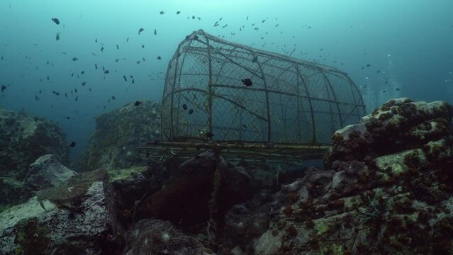 Chao Ley Sea Gypsies bamboo fish trap underwater on reef at 8 miles scuba diving in Koh lipe, Thailand
