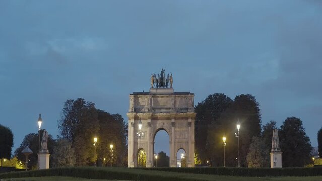 Triumphal Arch, famous landmark and tourist attraction in Paris, France. Action. Concept of tourism.