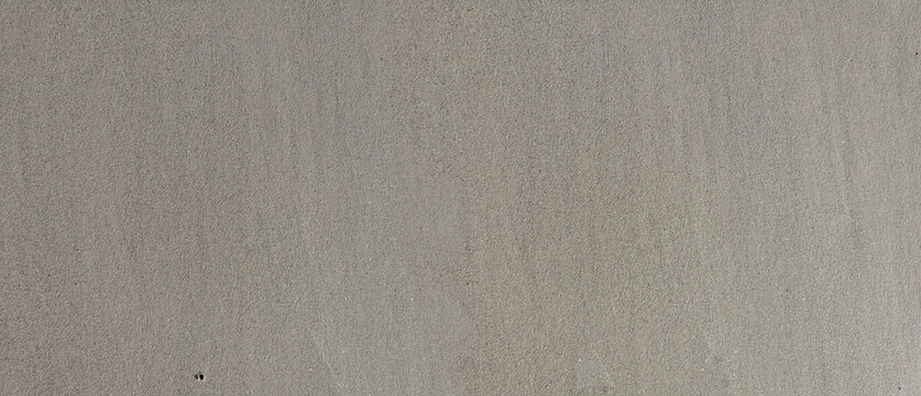 uniform background of wet sand