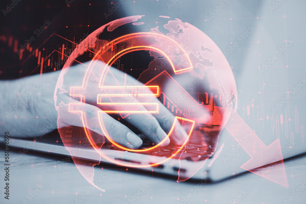 Poster close up of hands using laptop with falling global red euro arrow hologram on blurry background. mar